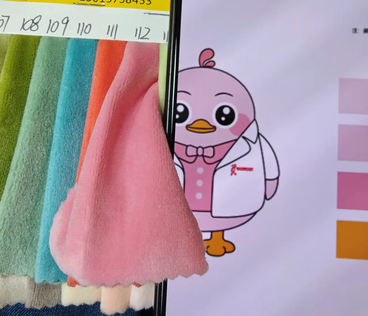 Plush prototype carrying a printed character design
