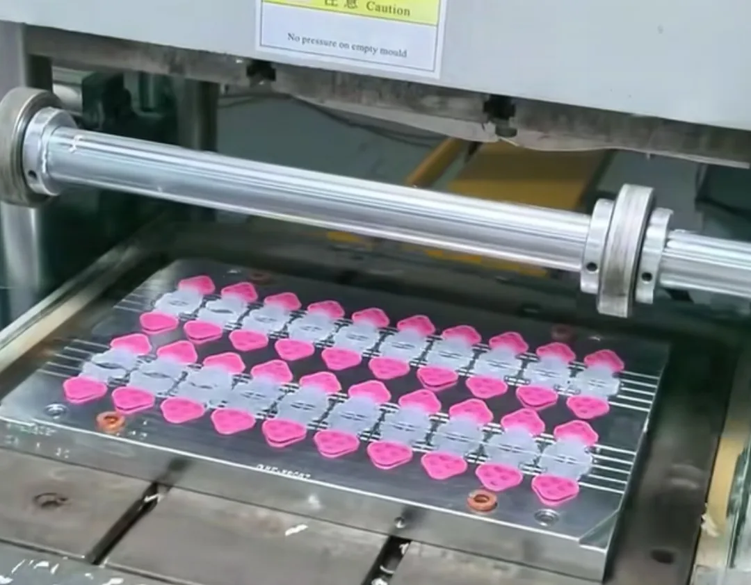 Silicone parts coming off a moulding machine