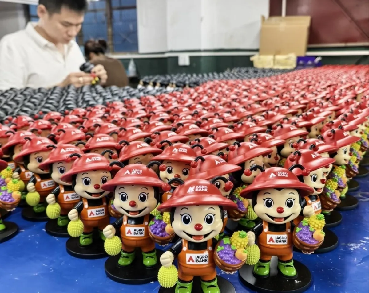 Finished resin figures from a production run, arranged in rows
